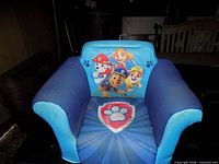 Front view showing Paw Patrol characters and seat graphics
