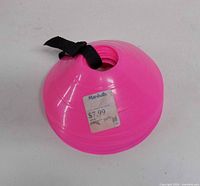 Stack of pink cones with Marshalls price sticker visible