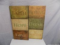 Front view of both canvas plaques showing words and colors