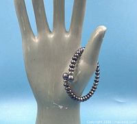 Bracelet displayed on mannequin hand showing overall appearance