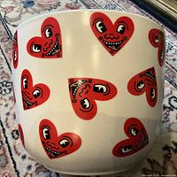 Front view showing heart-face pattern on planter