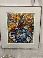 Full view of framed abstract flower painting