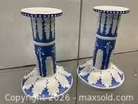 Front view of both blue and white candlestick holders