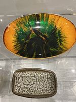 Top view of both trays showing size relation and designs