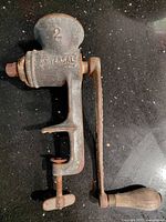 Side view showing Universal logo, hopper and clamp