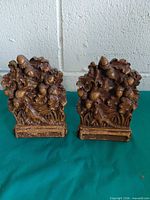 Front view of both bookends showing acorn & oak leaf motif
