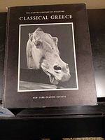 Front cover of the book showing title and sculpture image