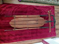 Top view of full sled showing deck, runners, front cross bar and rope