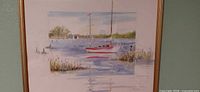 Full view of framed watercolor sailboat scene
