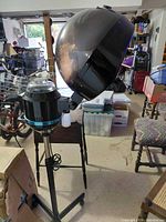 Full view of hair steamer on stand showing hood and base