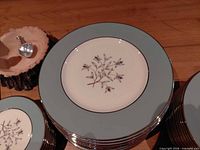 Stacks of dinner, salad and smaller plates showing pattern