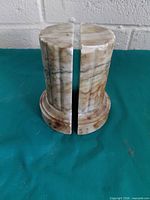 Pair of marble/onyx fluted column bookends upright showing fronts