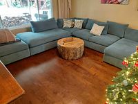 Full view of sectional with ottoman in center