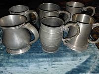Front group view of six pewter steins