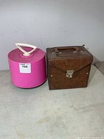 Pink Disk-Go-Case and brown vinyl record case side by side