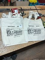 Two stacked canvas totes showing Historic Bath print