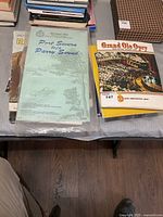 Chart, magazine, stack of books visible