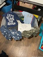 Overall view of tote with boys clothing items