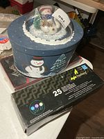 Blue snowman gift box with dome scene and boxed LED lights