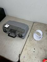 Dremel case closed beside white motion light on table