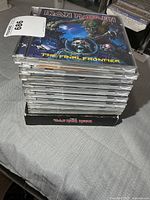 Stack of heavy metal CDs with Iron Maiden “The Final Frontier” on top