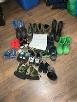 Overview of all children’s footwear arranged on floor