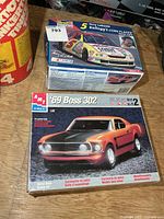 Both model kit boxes on workbench