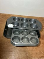 Stacked muffin pans and roasting pan overall view