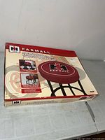 Sealed box showing Farmall stool packaging