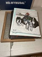 Stack of canvases and metal art panel