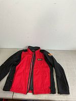 Front view of red and black Karbon Pontiac Cup jacket