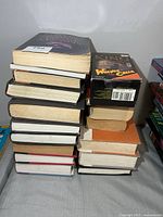 Two stacks of Stephen King hardcover books with Wolves of the Calla cassette box on top