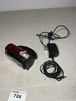 Full view of camcorder, power adapter and cable