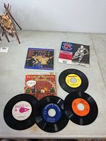 Group shot of sleeves and loose records on tabletop