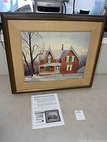 Front view of framed Paul Gauthier watercolour with appraisal document