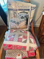 Both quilts, one in packaging, one folded with tag