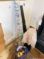 Group view of lot showing fabric rolls, wooden item, bag of yarn, macramé trim