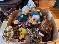 Box containing assorted plush toys and cloth dolls