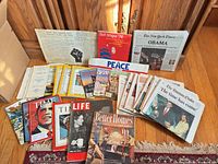 Group shot of assorted magazines and newspapers spread on floor