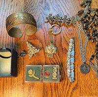 Group view of all nine jewelry pieces on wood surface