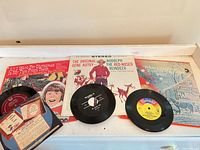 Front view of three 45s and three LP jackets