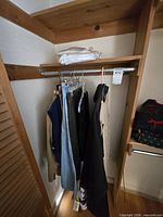 Garments hanging on closet rod