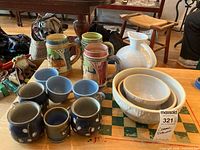 Group image of all 11 ceramic pieces on table
