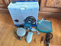 Group shot of all items: Wacom tablet, mouse, boxed fan, Apple mouse, Battery Eliminator box, cables and adapters