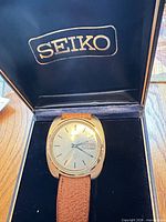 Watch in Seiko box showing dial, strap and branding