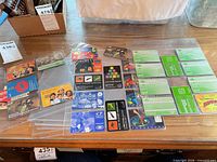 Overview of phonecards and binder pages spread on table