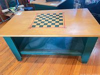 Overall view of coffee table showing chessboard top and lower shelf