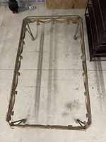 Top view of rectangular metal coffee table frame without glass top