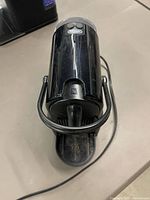 Top angled view showing overall unit, front lever, power cord