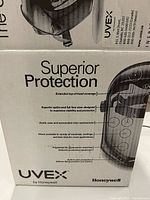 Box front showing Honeywell Uvex branding and protection details